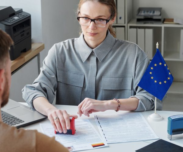 specialist-rejecting-visa-application-at-office.jpg